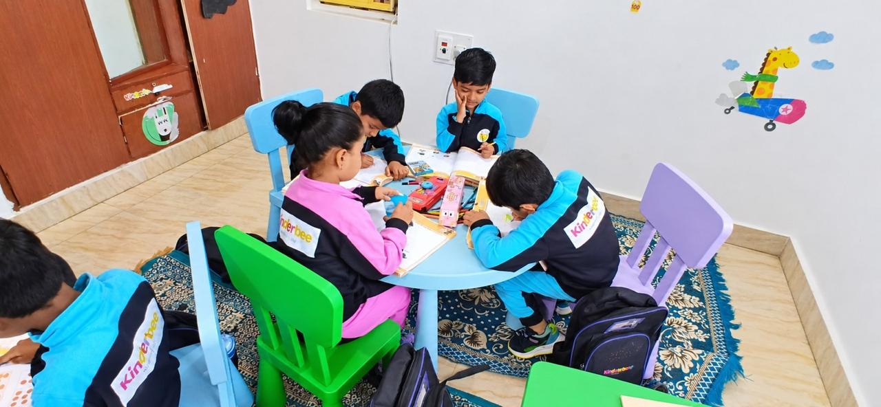 Kinderbee children learning together in a classroom