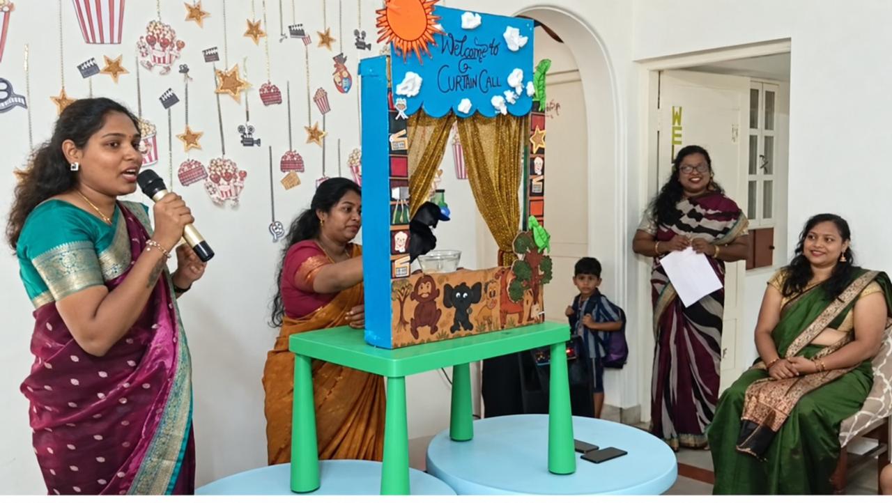 Kinderbee teachers presenting a puppet storytelling show